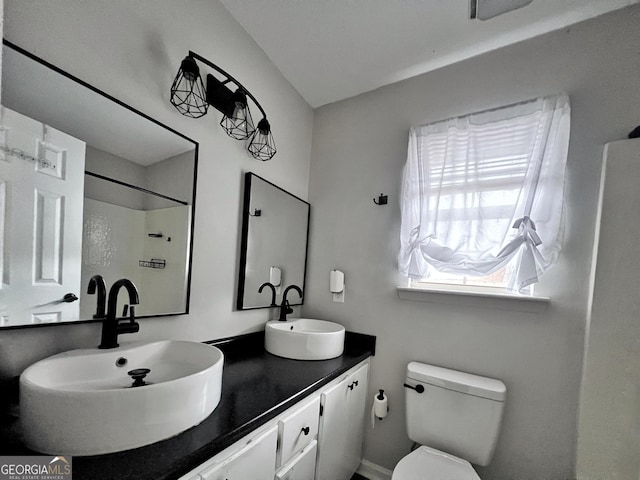 305 Clairemore Cir, Hinesville, GA 31313 - full bathroom with double vanity, a sink, a shower, and toilet