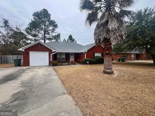 305 Clairemore Cir, Hinesville, GA 31313 - ranch-style home with brick siding, a garage, fence, and driveway