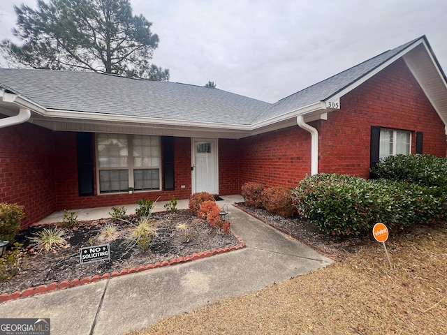 305 Clairemore Cir, Hinesville, GA 31313 - view of front of house featuring a shingled roof and brick siding