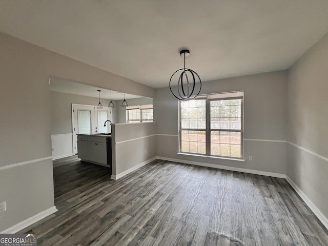 305 Clairemore Cir, Hinesville, GA 31313 - unfurnished dining area featuring baseboards, an inviting chandelier, and dark wood-style floors