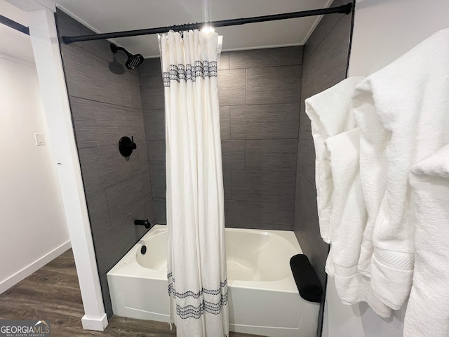 bathroom featuring shower / tub combo and hardwood / wood-style flooring