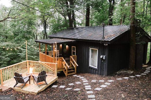 exterior space with a fire pit