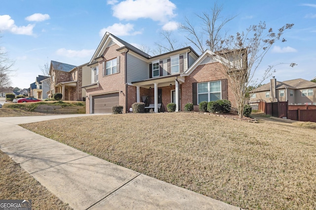 view of front of house featuring a garage and a front yard