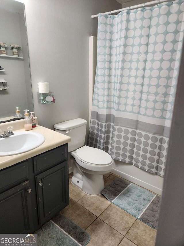 full bathroom featuring vanity, tile patterned flooring, shower / bath combination with curtain, and toilet