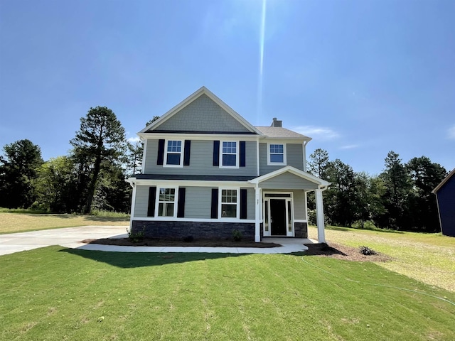 view of front of property with a front lawn and a porch