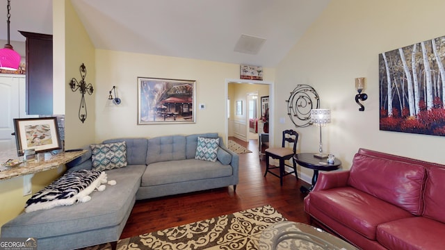 living room with dark wood-type flooring and vaulted ceiling