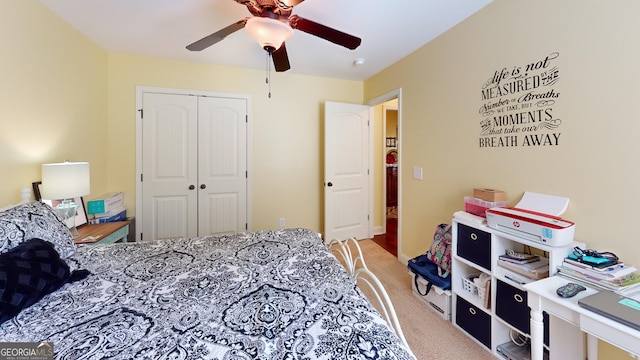 bedroom featuring carpet flooring, ceiling fan, and a closet