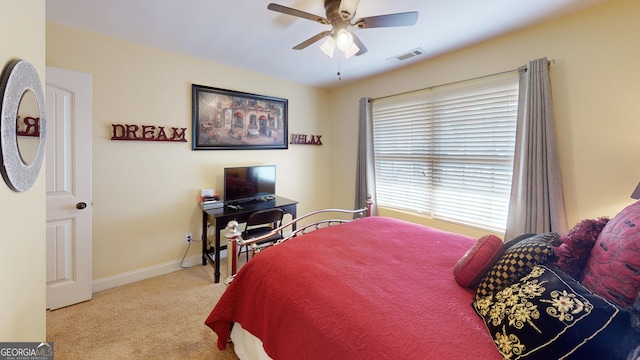 carpeted bedroom featuring ceiling fan