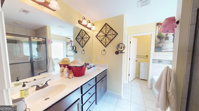 bathroom with vanity, tile patterned floors, and a shower with shower door