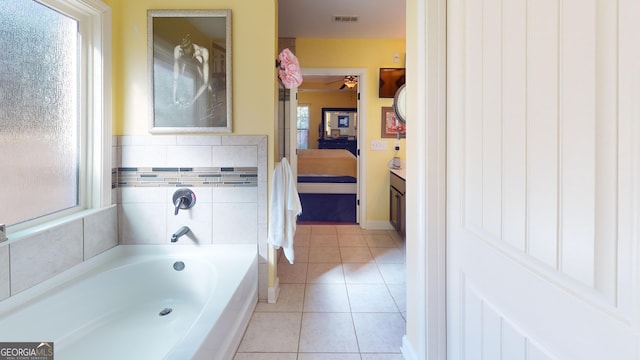 bathroom featuring tile patterned floors and a bathtub