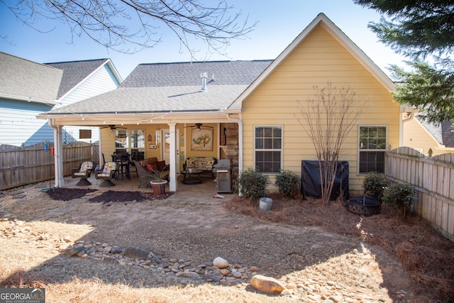 rear view of house featuring a patio and ceiling fan