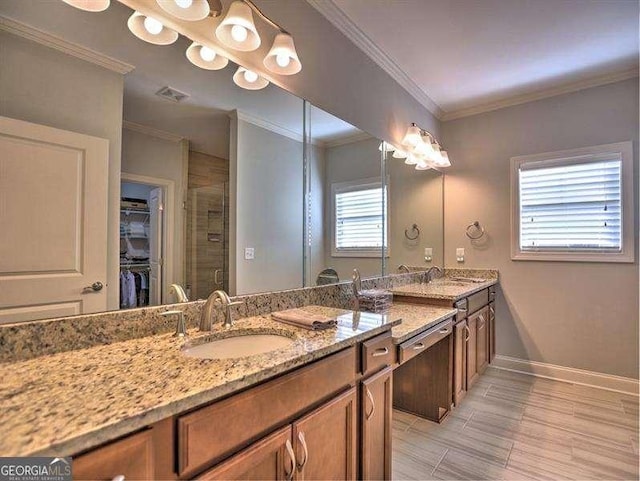 bathroom featuring vanity, ornamental molding, and an enclosed shower