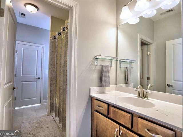 bathroom featuring tile patterned floors, vanity, and a shower with shower curtain