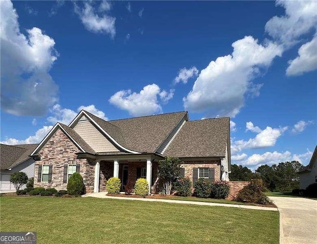 craftsman-style home with a front lawn