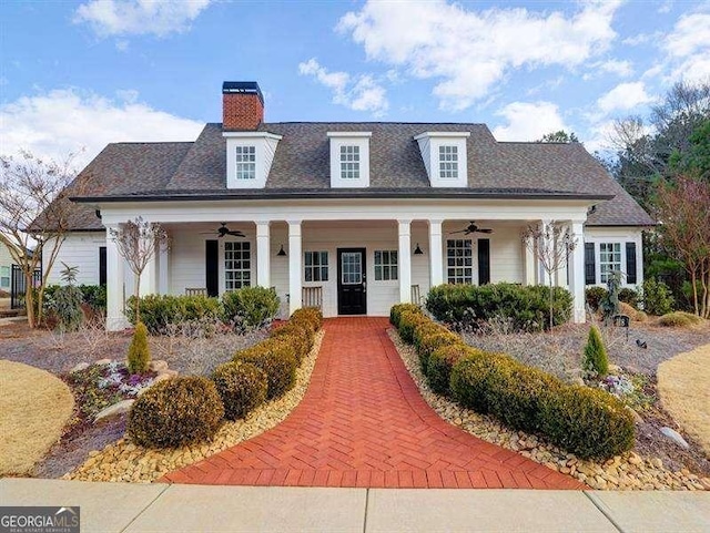 view of front of home with ceiling fan and covered porch