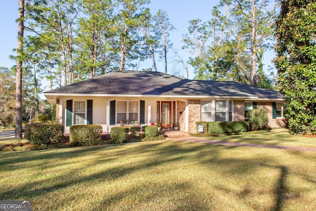 single story home with a porch and a front yard