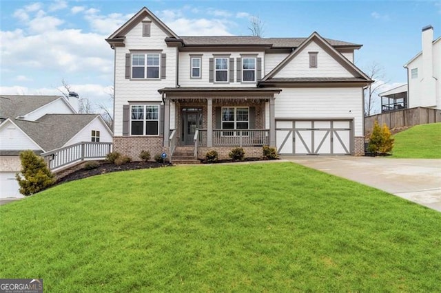 craftsman house featuring a porch, a garage, and a front yard