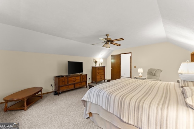 bedroom featuring lofted ceiling, light carpet, and ceiling fan