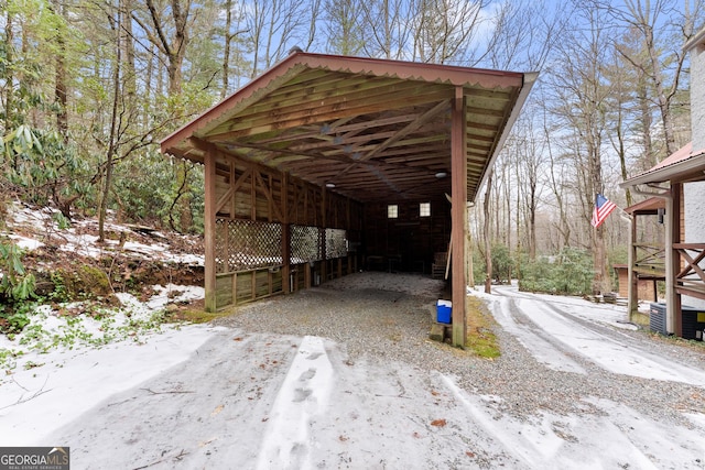 view of snow covered parking area