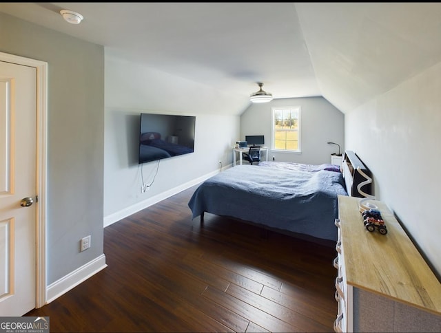 bedroom with lofted ceiling and dark hardwood / wood-style flooring