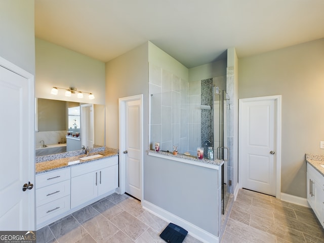 bathroom with vanity and an enclosed shower