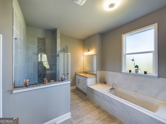 bathroom featuring vanity and separate shower and tub