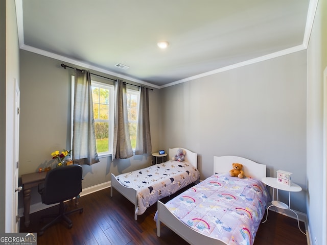 bedroom featuring ornamental molding and dark wood-type flooring