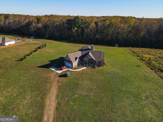 birds eye view of property with a rural view