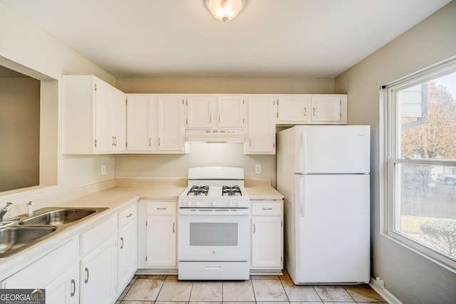 kitchen with white cabinetry, sink, white appliances, and plenty of natural light