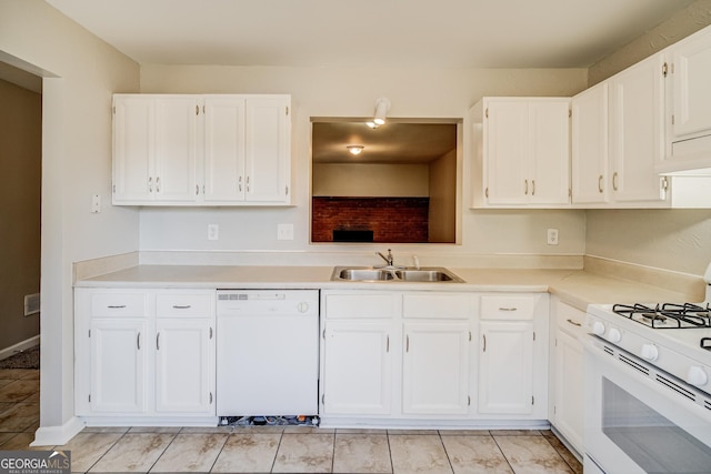 kitchen featuring white appliances, sink, and white cabinets