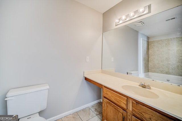 bathroom with vanity, tile patterned floors, and toilet