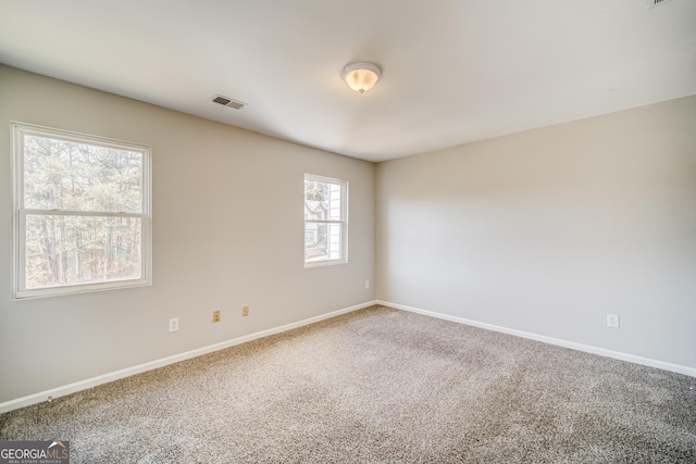 unfurnished room with carpet floors