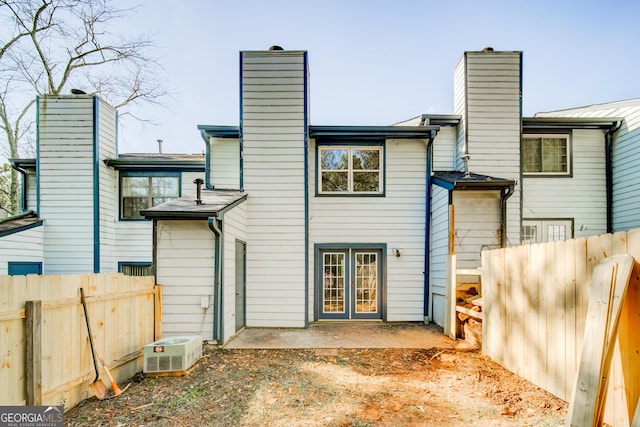 rear view of property featuring a patio area