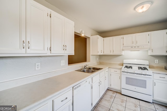 kitchen with sink, white appliances, white cabinets, and light tile patterned flooring