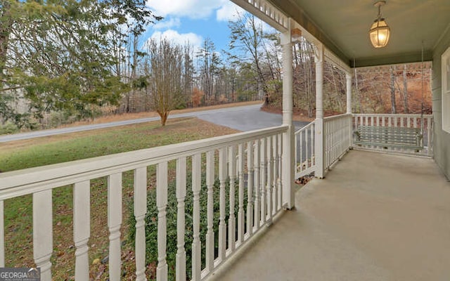 balcony featuring a porch