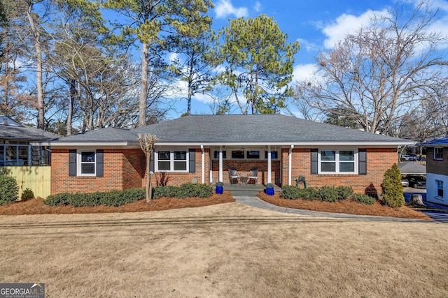 ranch-style house featuring covered porch