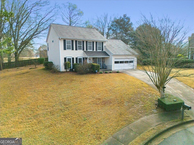 view of front of home featuring a garage and a front lawn