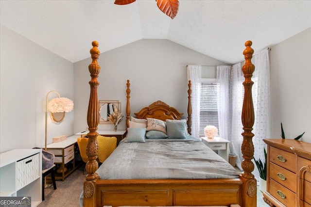 carpeted bedroom featuring a textured ceiling, vaulted ceiling, and ceiling fan