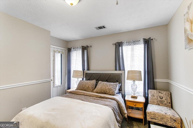 bedroom with a textured ceiling