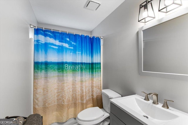 full bathroom featuring vanity, shower / bathtub combination with curtain, and toilet