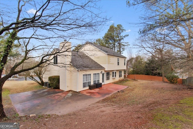 view of home's exterior with central AC and a patio area