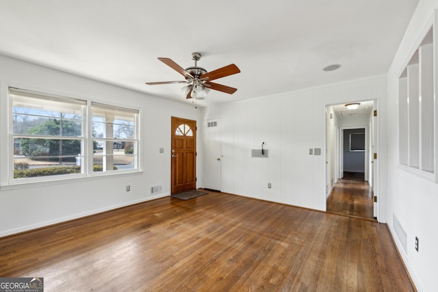 entrance foyer with dark hardwood / wood-style floors and ceiling fan