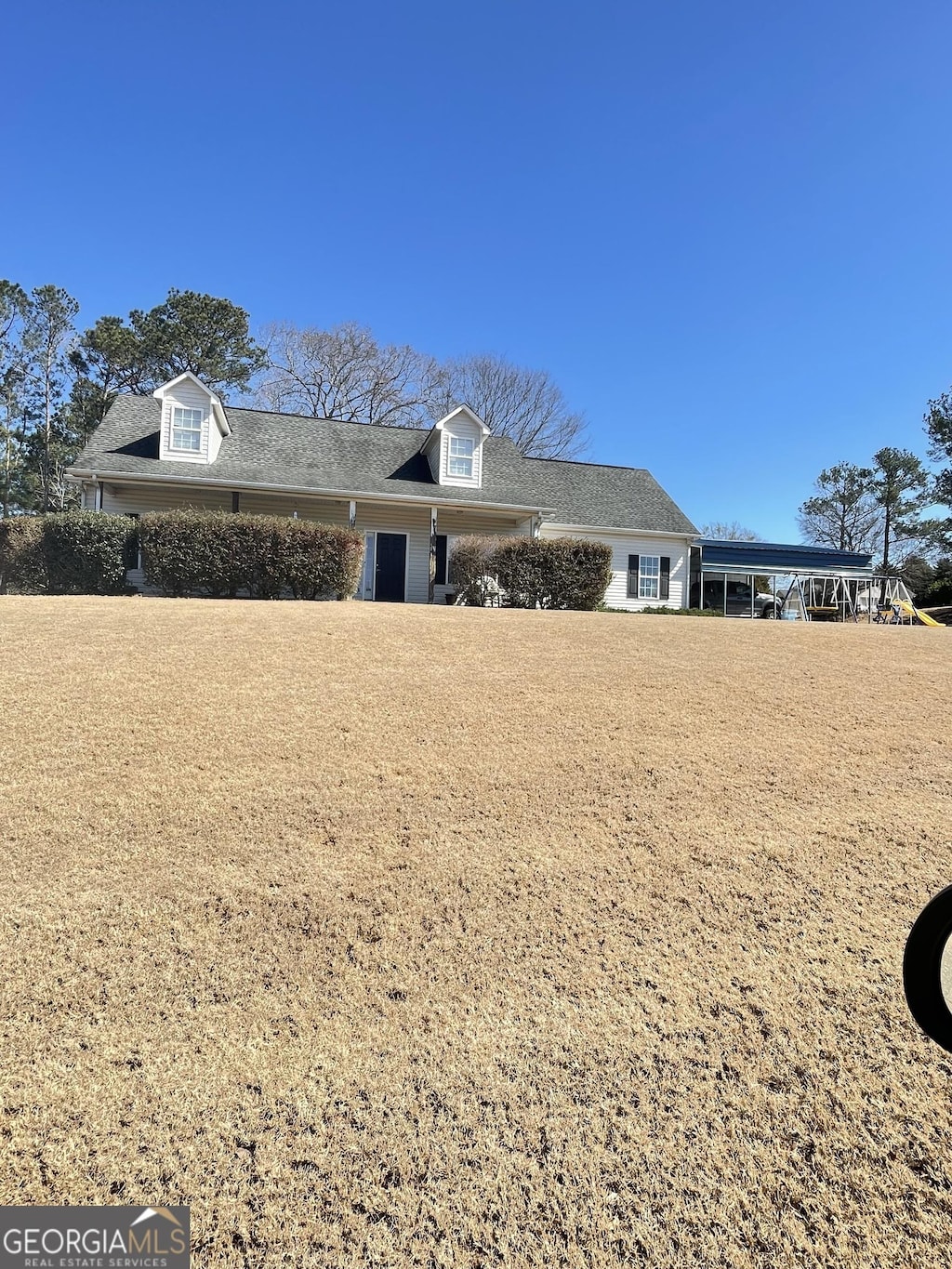 view of home's exterior featuring a lawn