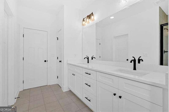 bathroom with vanity and tile patterned floors