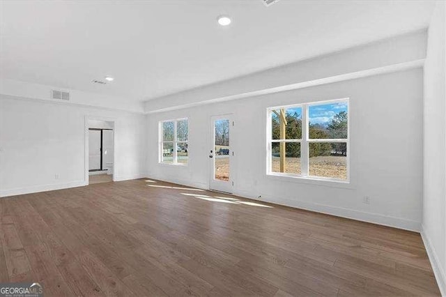 spare room featuring dark hardwood / wood-style floors