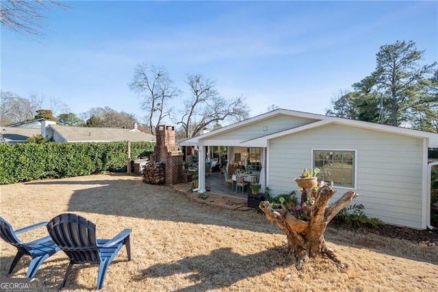 rear view of property featuring a patio