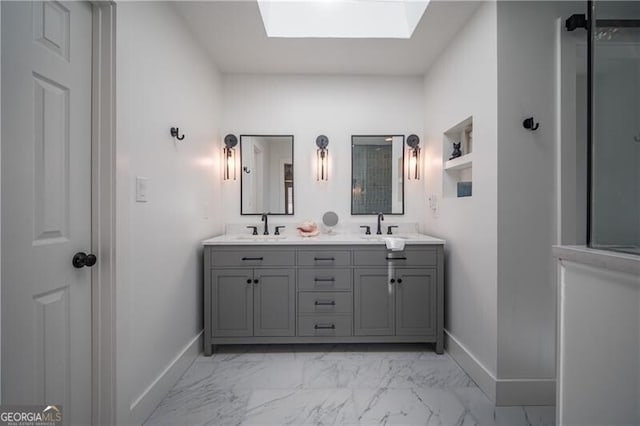 bathroom with vanity and a skylight