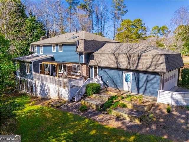 rear view of house with a yard