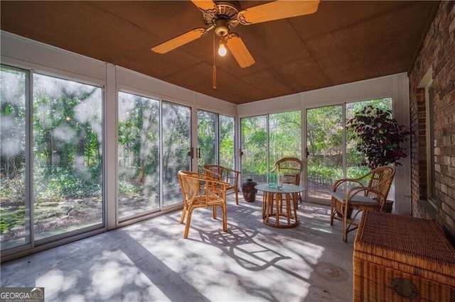 sunroom / solarium with ceiling fan and plenty of natural light