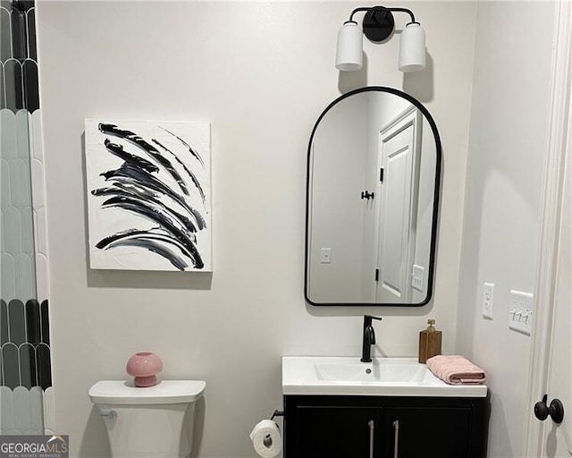 bathroom with vanity and toilet